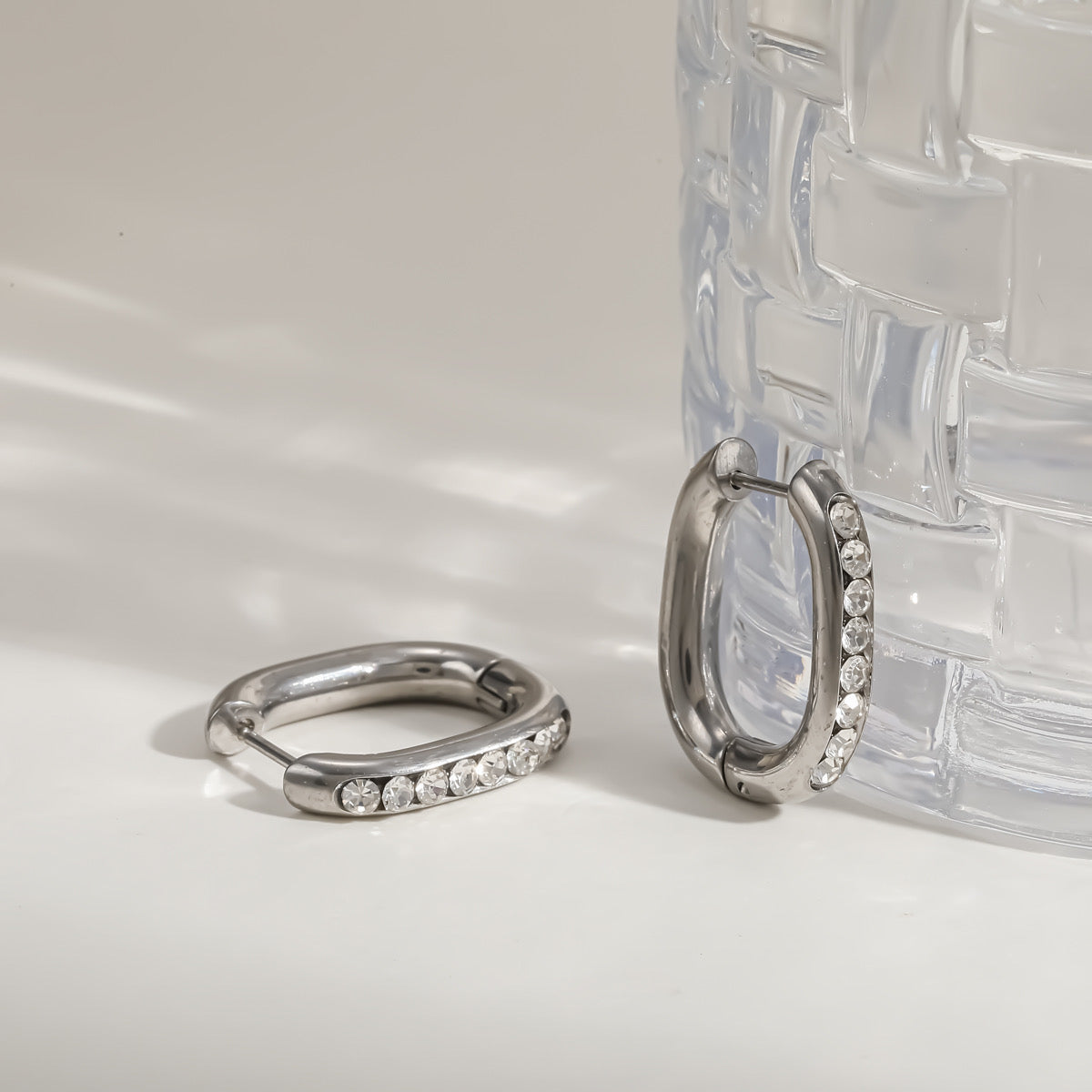 Oval Crystal Inset Silver Huggie Hoop Earrings