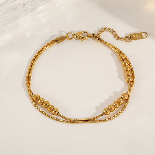 Gilded Dual-Strand Orb Wristlet
